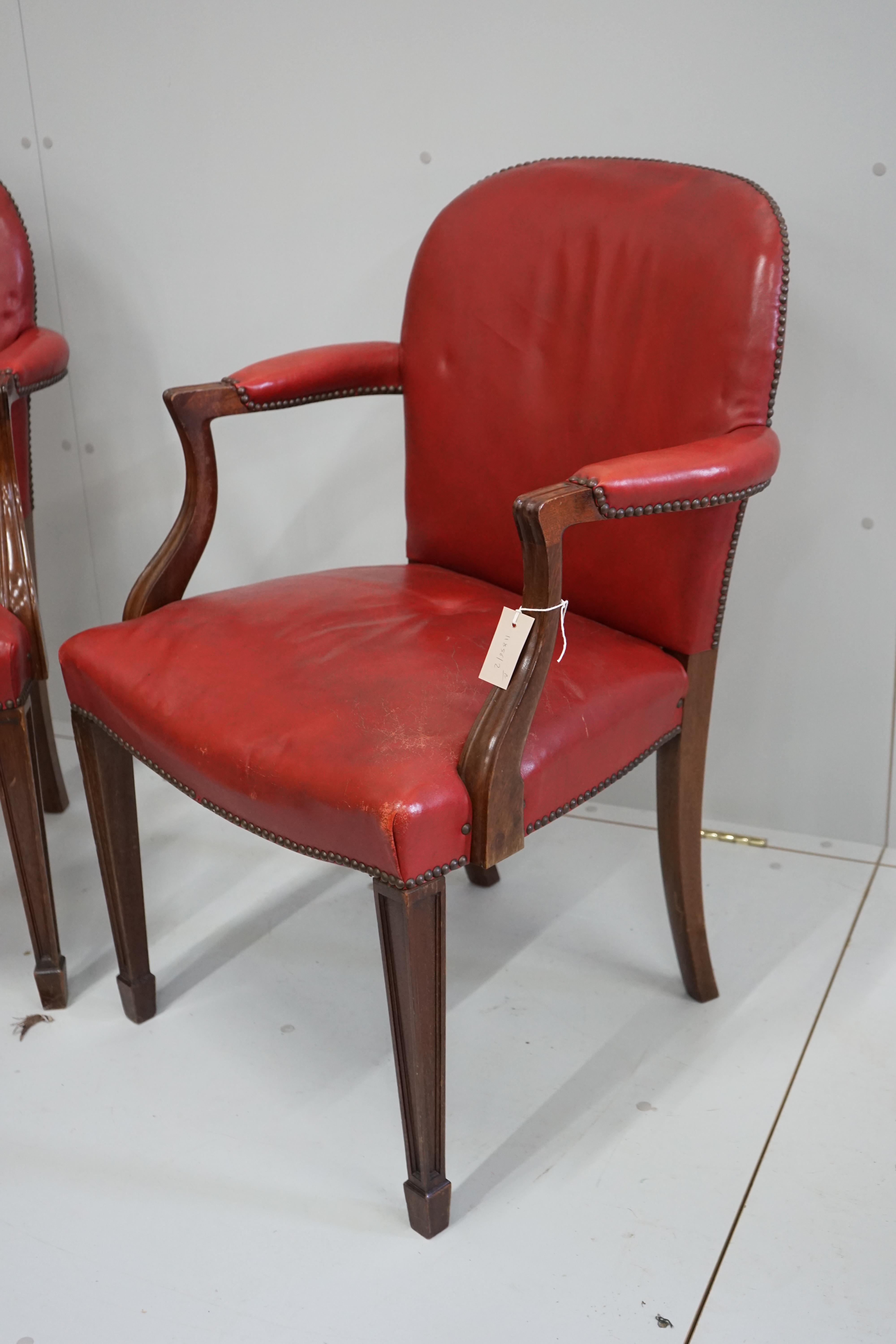 A pair of early 20th century elbow chairs, width 63cm, depth 52cm, height 94cm